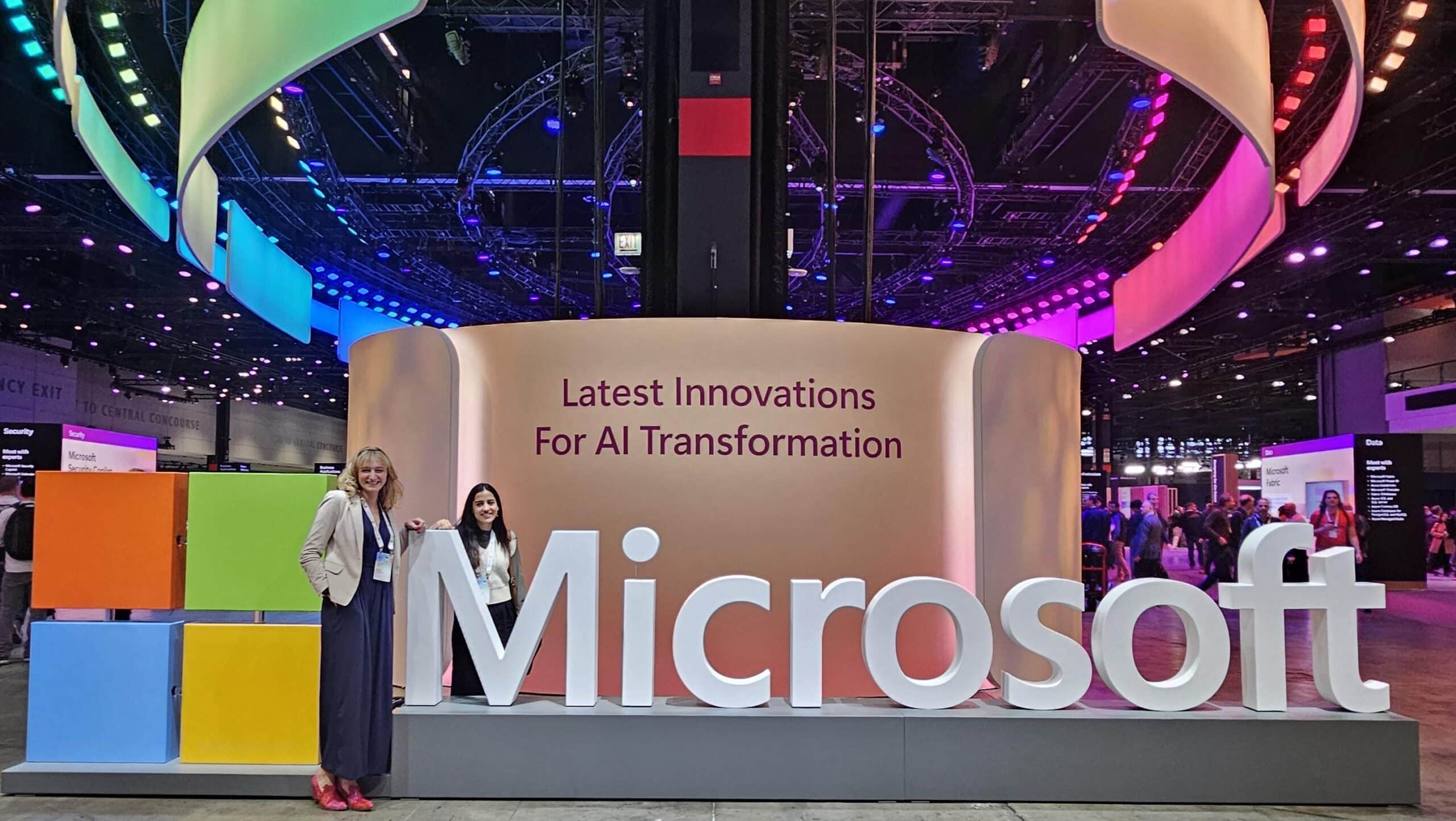 Our team checking in at Microsoft Ignite 2024 in front of the official Microsoft event signage.